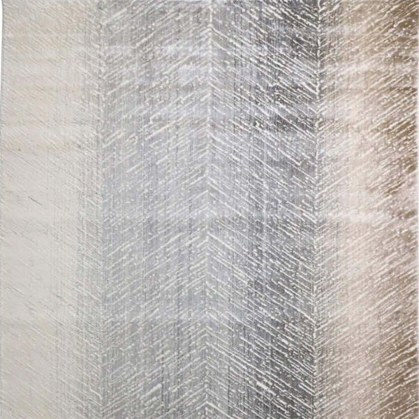 Square close up view of the Auger modern art rug, in a chevron pattern, flowing in an ombre hue of brown and grey.