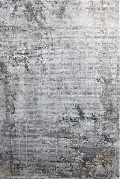 Full view of the Bastien rug, silky with a modern distressed design.