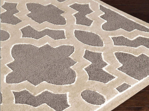 Hand-tufted of New Zealand wool, this top seller Candice Olson plush rug brings out beautiful lattice patterns in earthy tones. A conversation piece that enlivens any space.