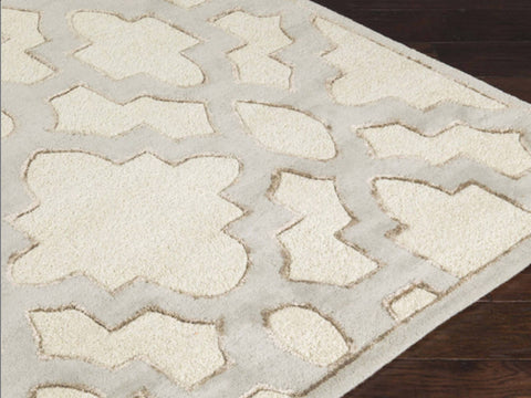 Corner view of Lattice Gray Rug with contrasting Ivory and gray lattice patterns.