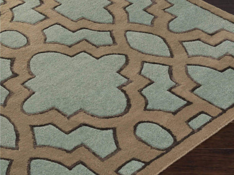 Corner close up of the hand tufted wool details on the Candice Olson Lattice wool rug, in a lush teal and brown hue.
