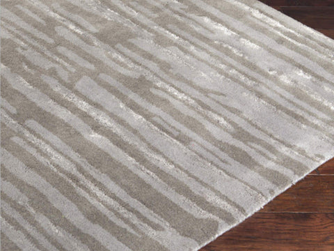 Zoom in details of the Primeval wool Rug with a blend of abstract art.