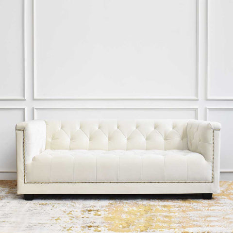 Hand tufted details on Chesterfield sofa, creating the perfect modern sofa with a mid-century twist. The perfect statement sofa for your living room.