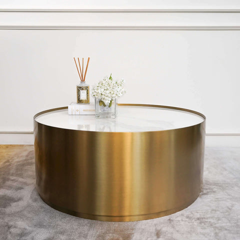 Go with the white and gold Marc coffee table and table decor for a minimalistic and classic living room theme.