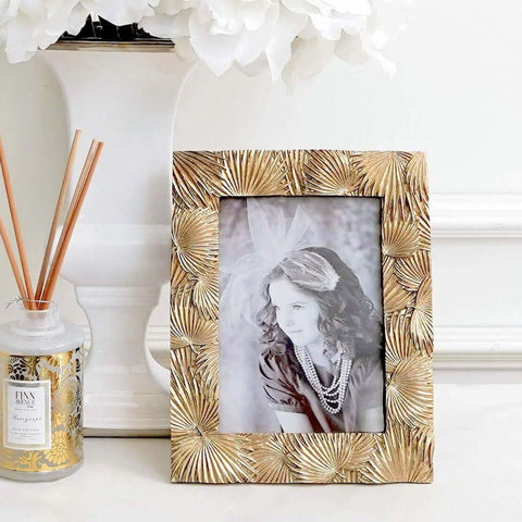 Palms Gold Leaves Photo Frame, gives your room a breezy and tropical vibe.