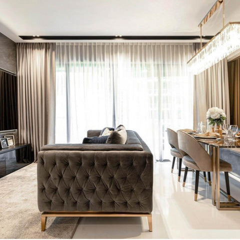 This modern Fitzgerald Chesterfield Sofa in plush grey velvet provides affordable luxury in this stunning condo, expertly designed by Singapore interior designer.