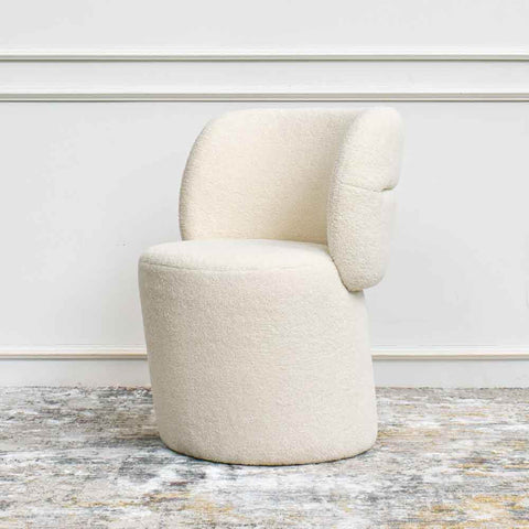 Side view of bonbon accent chair in ivory in popular boucle 'looped fiber' fabric.