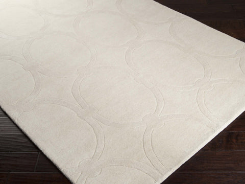 Hand-tufted of New Zealand wool, this Candice Olson plush rug exudes true art form with details of unique infinity rings in luxurious ivory. A conversation piece that enlivens any space.