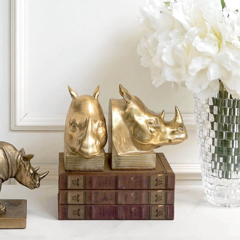 Gold Rhinoceros Bookends with books and flowers Entrance Decor Ideas.