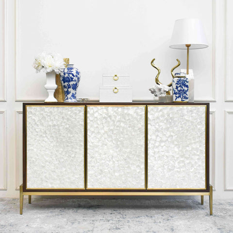 Harbour Cabinet Sideboard features hand-crafted natural Mother of pearl and features a timeless modern luxury interior design with a hint of coastal freedom and decorated with carefree lifestyle design decor.