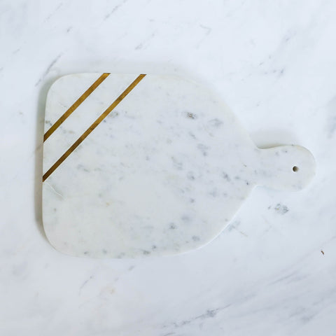 Natural white marble, luxurious and timeless. Bring out the elegance in your dining room with this cheese platter board on display.