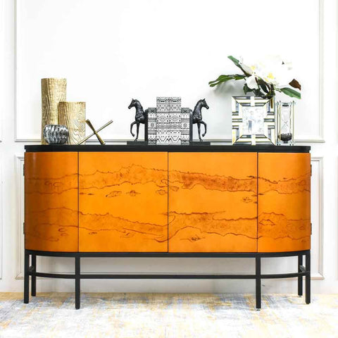 Defining the essence of Modern Luxury Design, this Reves 4-door sideboard features all round storage behind curved doors flanked by storage space with curved outer sides. Decorated in style, this sideboard works perfectly in entryway or dining room for a pop of glamour.