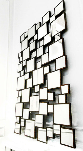 Geometric Wall Mirror hung on wall gives off a grand entrance look.
