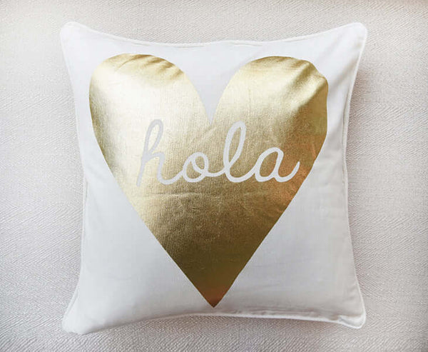 White and gold statement piece cushions.