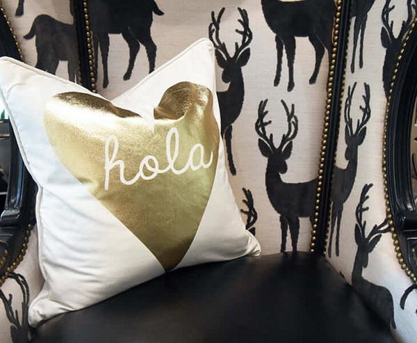 Add a fun and light message on your cushions to brighten your living room look for the holidays. 