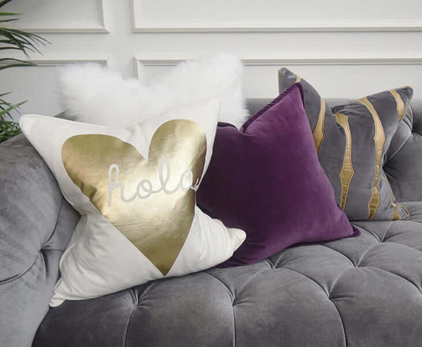 Layer some Grey, Purple, Ivory and a dash of Gold cushions on your sofa. 