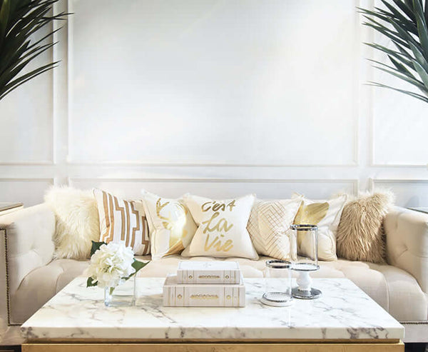 Cushion decor and placement ideas for a neutral Ivory and beige themed sofa.