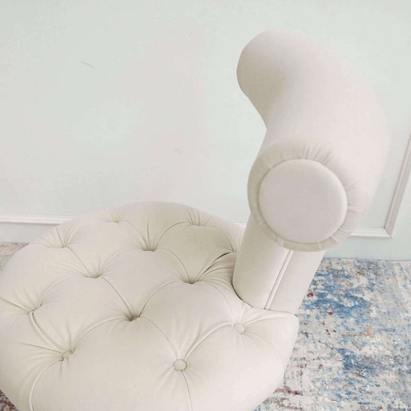 Side view of T-back ivory cream Abbey chair with tufted details on seat.
