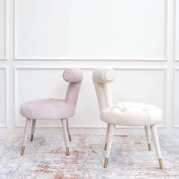Side view of Abbey dressing chair in trendy blush pink and ivory .