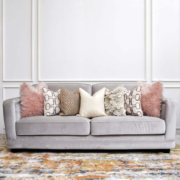 Adaliz Sofa in a styled living room setting, featuring throw pillows and soft lighting for a cozy, luxurious ambiance.