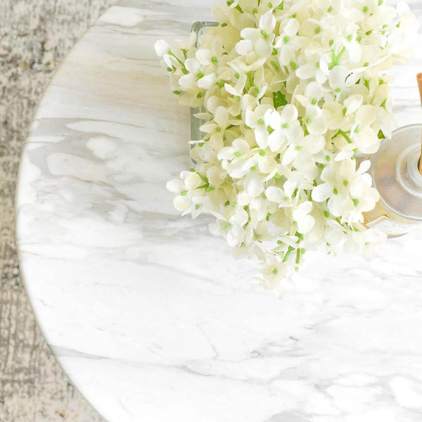 Aleta Side Table's round cultured marble top looks as natural and beautiful as natural marble. 