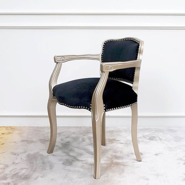 Arte hand-carved gold vanity armchair in black velvet with contrasting silver nail head trim design.