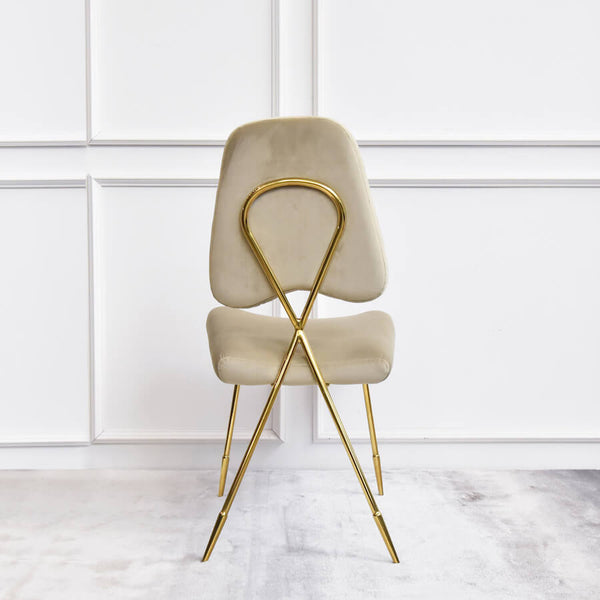 Back view of Artus gold dining chair, crossed back polished stainless steel gold back and legs.