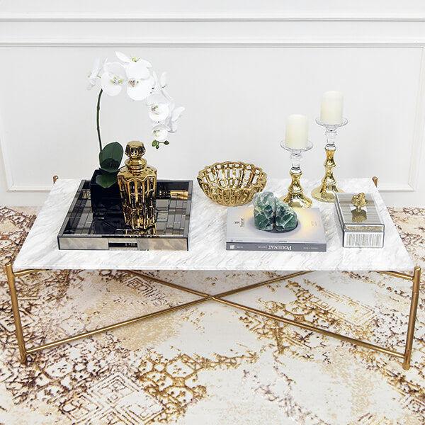 White marble table top with stainless steel crossed legs frame.