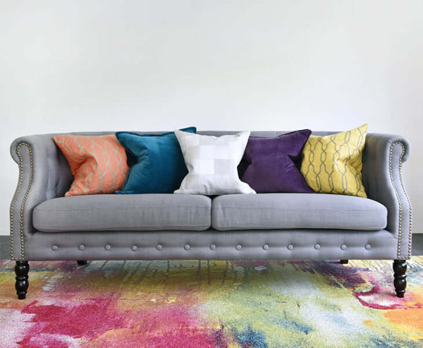 Bold jewel tone Avery cushions on Fayette sofa.