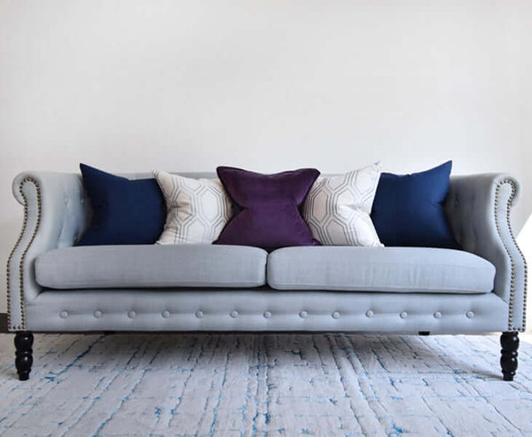 Cool tone Avery Cushions styling ideas on sofa.