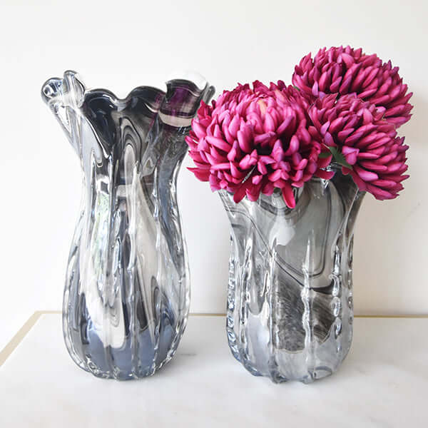 Free-form contoured art vases in varying grey swirls.