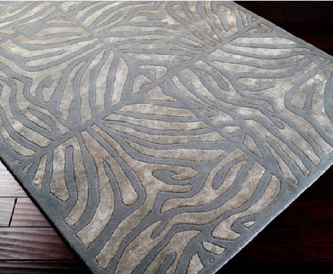 Hand-tufted of New Zealand wool, this Candice Olson plush rug exudes true art form with carved details of unique maze pattern in different shades of modern gray. A rug that makes any room looks luxurious.