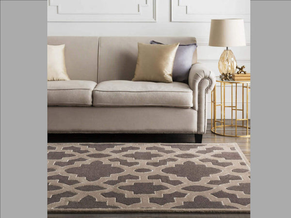 Candice Olson Lattice Earth Rug styled together with a neutral brown sofa and gold side table.