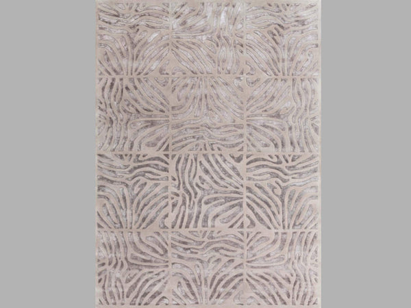 Labyrinth rug, a blend of brown and grey colours in an intricate maze like pattern.