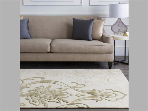 Pair the Candice Olson Floret Light Rug design with a matching beige sofa and ivory marble side table for a bright and neutral living room look.