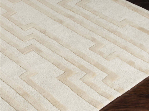 100% Hand tufted New zealand wool close up look of the geometric lines on the Morphology Ivory Rug.