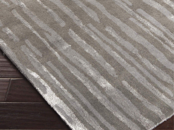 Candice Olson modern classics primeval abstract art rug in various shades of gray.