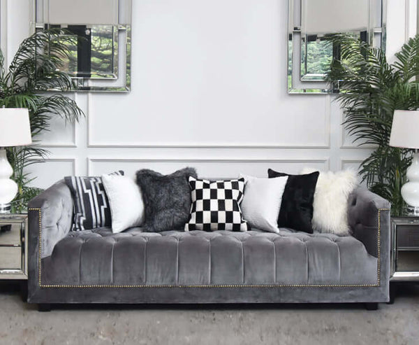 Create an Achromatic look with shades of black, gray and white cushions adorning your sofa. 