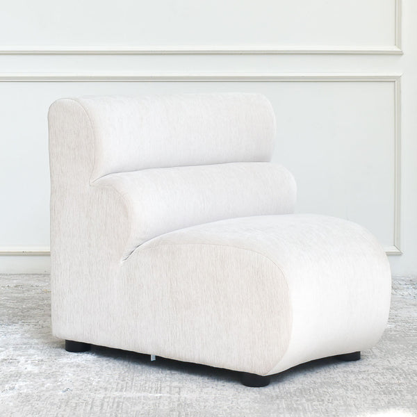 Cava 1-Seater Concave Modular Sofa Armchair, angled view, detailing the smooth lines and premium velvet fabric texture.