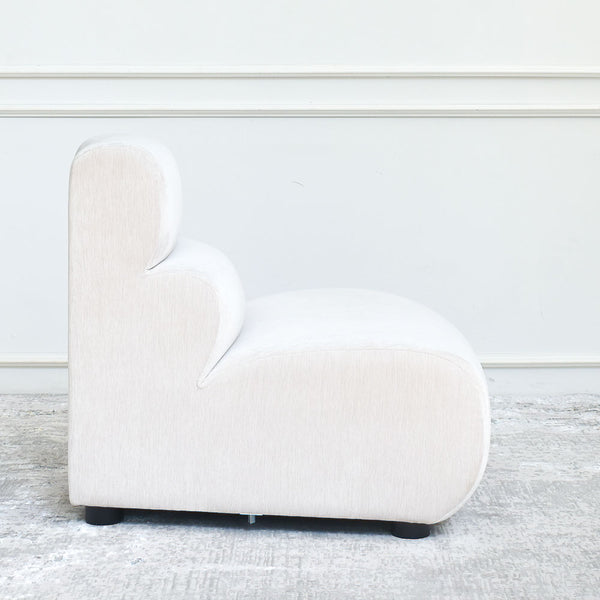 Cava 1-Seater Convex Modular Sofa Armchair inbeige velvet, side view displaying its versatile outward curve, perfect for flexible seating designs.