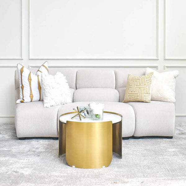 Cava 3-Seater Curved Modular Sofa styled with throw cushions and coffee table in White & Gold Themed in luxurious living room, showcasing a cozy yet luxurious seating solution for HDB or BTO living rooms.