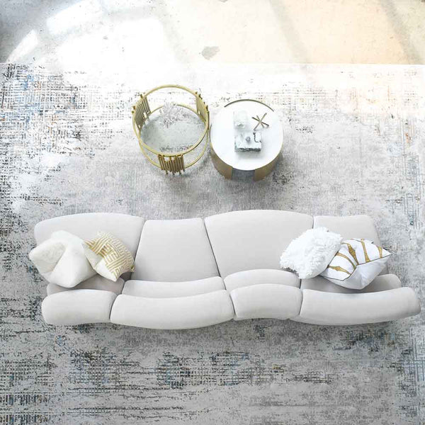 Cava 4-Seater Curved Modular Sofa coupled with round marble coffee tables on a luxury Turkish rug, top view displaying its adaptable configuration, suitable for modern living spaces.
