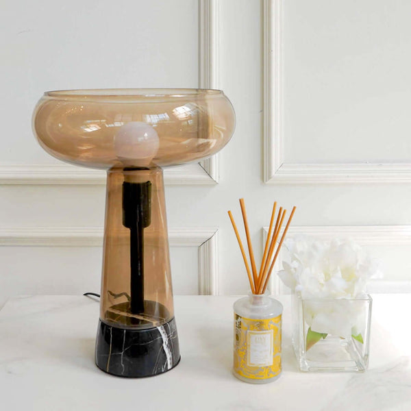 This mid-century styled lamp is re-designed with a contemporary twist. Taking the curves of a pedestal glass lighthouse, it showcases a vintage-style LED Edison bulb that features a decisively industrial feel. 