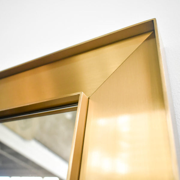 Claudine mirror for full-body reflection, enhancing room aesthetics with its timeless, minimalist design.