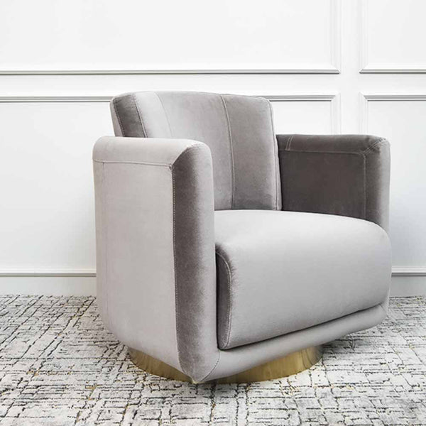 Angled view of Clyde Grey Armchair sits on anti-rust stainless steel base that is plated in gold. This luxurious armchair comes with all-round back cushion that provides quality back support.