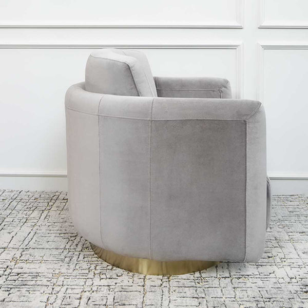 Side view of Clyde Grey Armchair shows high quality workmanship of armchair that sits on anti-rust stainless steel base that is plated in gold.