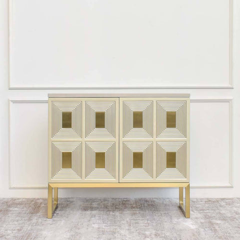 The Contratto 2 Door sideboard exudes a modern vintage aesthetic, with hand painted champagne gold doors and wood veneer table top. 