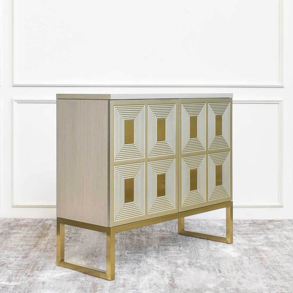 Angled side view of the Contratto sideboard, framed gold legs for a sleek and slim look. 