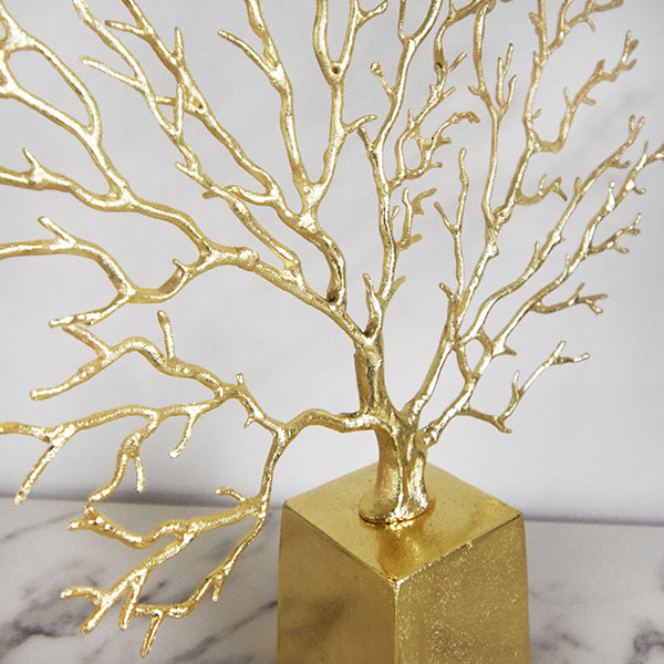 Zoom in view of the brass details on the Prosperite coral branches.