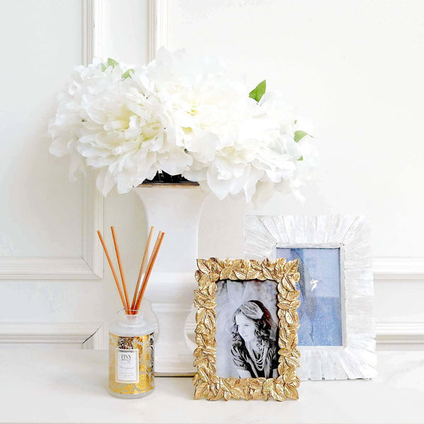 Decor Ideas with Pachira Photo Frame and Flowers vases.